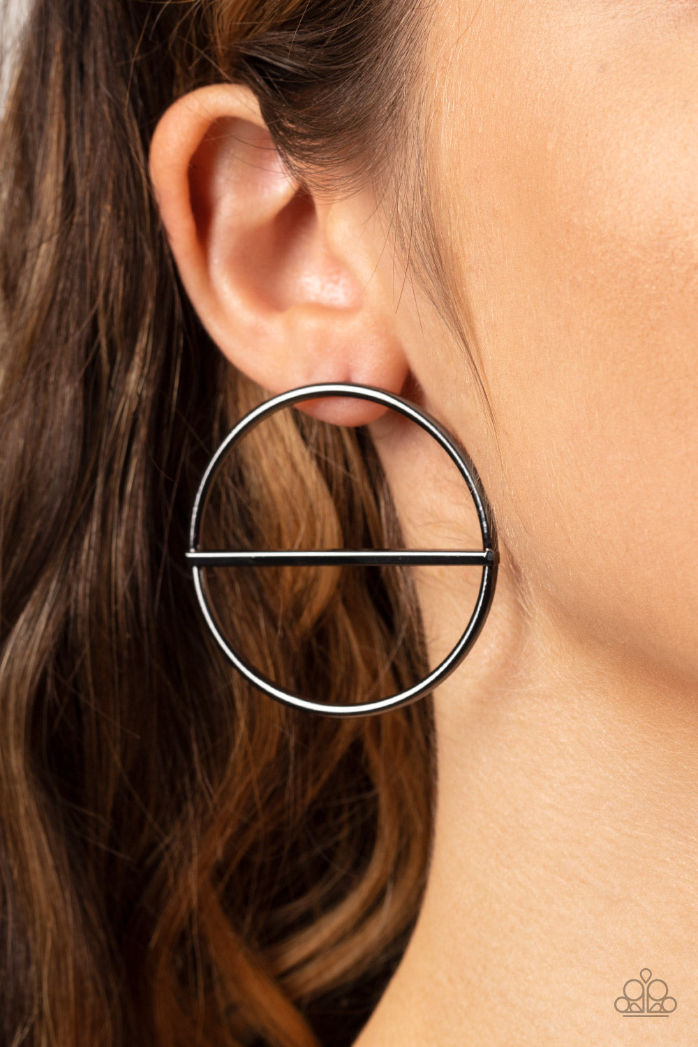 A glistening gunmetal bar runs horizontally across the center of an oversized gunmetal hoop, adding a timeless twist to the classic display. Earring attaches to a standard post fitting.  Sold as one pair of post earrings.