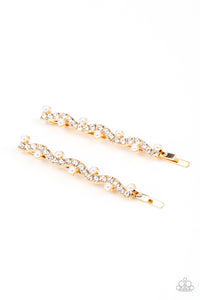 A wavy row of glittery white rhinestones is flanked between dainty white pearls along the front of a gold bobby pin for a refined fashion.  Sold as one pair of decorative bobby pins.
