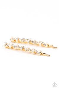 A wavy row of glittery white rhinestones is flanked between dainty white pearls along the front of a gold bobby pin for a refined fashion.  Sold as one pair of decorative bobby pins.