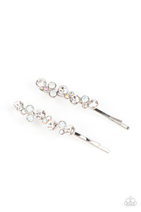 A bubbly cluster of white, opal, and iridescent rhinestones are encrusted across the front of a classic pair of silver bobby pins for an effervescent fashion.  Sold as one pair of decorative bobby pins.