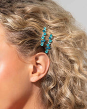 Load image into Gallery viewer, A bubbly cluster of light blue, dark blue, and iridescent rhinestones are encrusted across the front of a classic pair of silver bobby pins for an effervescent fashion.  Sold as one pair of decorative bobby pins.
