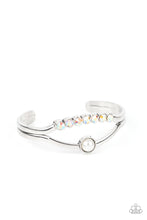 Load image into Gallery viewer, A row of iridescent rhinestones and a solitaire white pearl adorn the layered center of a classic silver cuff, creating a timeless piece around the wrist.  Sold as one individual bracelet.
