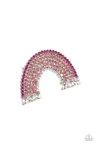 Infused with oversized white rhinestones, glittery rows of pink, iridescent, and white rhinestones arc into a sparkly rainbow centerpiece. Features a standard hair clip on the back.  Sold as one individual hair clip.