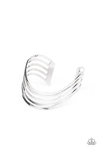 Layers of flat silver bars delicately curve in a wavy fashion across the wrist, coalescing into an airy cuff.  Sold as one individual bracelet.