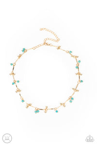 Pairs of dainty gold beads and turquoise stone beads dangle between faceted gold bars that interconnect around the neck, creating an earthy fringe. Features an adjustable clasp closure.  Sold as one individual choker necklace. Includes one pair of matching earrings.