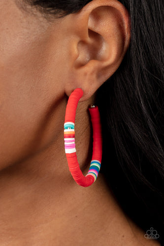Rubbery red, blue, green, pink, orange, yellow, and white bands are threaded along an oversized silver hoop, creating a courageous pop of color. Earring attaches to a standard post fitting. Hoop measures approximately 2 1/4