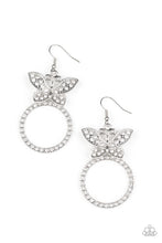Load image into Gallery viewer, A white rhinestone encrusted silver butterfly flutters atop a silver ring dotted in matching white rhinestones, resulting in a dazzling statement piece. Earring attaches to a standard fishhook fitting.  Sold as one pair of earrings.

