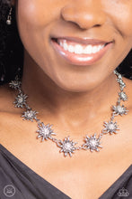 Load image into Gallery viewer, Featuring studded silver or white rhinestone encrusted centers, lifelike silver daisies gradually increase in size as they link around the necklace for a fashionably floral display. Features an adjustable clasp closure.  Sold as one individual choker necklace. Includes one pair of matching earrings.
