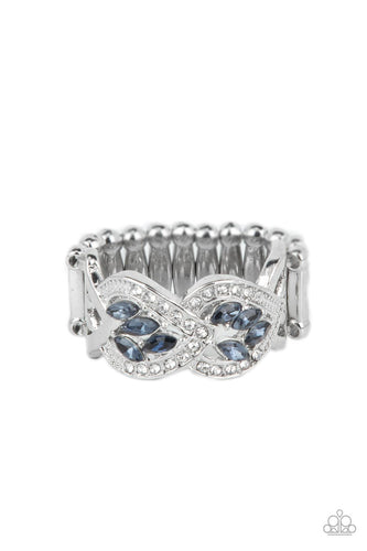 A dainty collection of blue marquise cut rhinestones delicately cluster inside the centers of two leafy silver frames that delicately overlap across the finger. The leafy silver frames are encrusted in sections of glassy white rhinestones and dainty silver studs, adding timeless twinkle to the elegant centerpiece. Features a stretchy band for a flexible fit.  Sold as one individual ring.