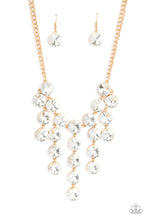 Load image into Gallery viewer, Encased in glistening gold fittings, dramatically oversized white rhinestones delicately link into twinkly tassels that taper off into a jaw-dropping fringe below the collar. Features an adjustable clasp closure.  Sold as one individual necklace. Includes one pair of matching earrings.
