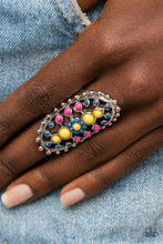 Load image into Gallery viewer, Dainty Illuminating, Mykonos Blue, and Fuchsia Fedora beads dot the airy front of a studded silver oval frame, creating a colorful floral pattern across the finger. Features a stretchy band for a flexible fit.  Sold as one individual ring.
