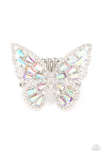 Load image into Gallery viewer, A glitzy collection of emerald cut iridescent rhinestones are sprinkled across the studded wings of a shiny silver butterfly, resulting in a whimsical centerpiece atop the finger. Features a stretchy band for a flexible fit.  Sold as one individual ring.
