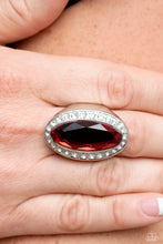 Load image into Gallery viewer, Bordered by a glitzy ring of white rhinestones, an oblong red gem embellishes the center of a dramatically oversized silver frame for a blinding finish. Features a stretchy band for a flexible fit.  Sold as one individual ring.
