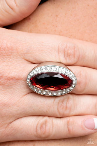 Bordered by a glitzy ring of white rhinestones, an oblong red gem embellishes the center of a dramatically oversized silver frame for a blinding finish. Features a stretchy band for a flexible fit.  Sold as one individual ring.