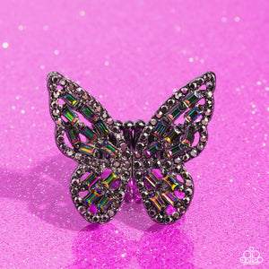 Dainty oil spill emerald-cut rhinestones are sprinkled across the gunmetal wings of a butterfly that is encrusted in dauntless hematite rhinestones for a dramatically dazzling finish. Features a stretchy band for a flexible fit.  Sold as one individual ring.