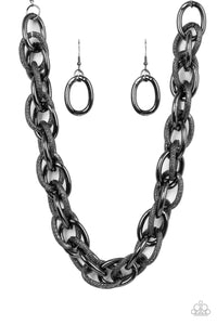 Featuring smooth and glitzy textured finishes, two oversized gunmetal chains interlock into a single chain below the collar for an intense industrial display. Features an adjustable clasp closure.  Sold as one individual necklace. Includes one pair of matching earrings.