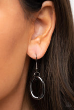 Load image into Gallery viewer, Black circle hanging from a gunmetal fish hook earring.
