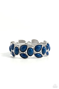 Glassy white rhinestones are sprinkled between bubbly clusters of Mykonos Blue oval, teardrop, and marquise shaped beads that are threaded along stretchy bands around the wrist for a colorfully leafy finish. Sold as one individual bracelet.