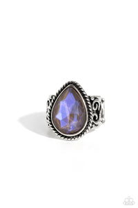 Featuring an iridescent UV finish, an oversized brown teardrop gem is pressed in the center of a textured silver frame atop a thick silver band whirling with silver filigree. Features a stretchy band for a flexible fit. Due to its prismatic palette, color may vary.  Sold as one individual ring.