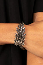 Load image into Gallery viewer, Feathery silver frames delicately overlap across the center of the wrist, creating a boa-like centerpiece atop rows of rustic silver chains. Features an adjustable clasp closure.  Sold as one individual bracelet.
