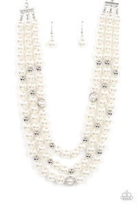 Infused with silver beads and silver rings, a bubbly collection of white pearls are threaded along invisible wires that cascade into effervescent layers below the collar. Features an adjustable clasp closure.  Sold as one individual necklace. Includes one pair of matching earrings.