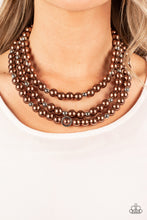 Load image into Gallery viewer, Infused with silver beads and silver rings, a bubbly collection of brown pearls are threaded along invisible wires that cascade into effervescent layers below the collar. Features an adjustable clasp closure.  Sold as one individual necklace. Includes one pair of matching earrings.
