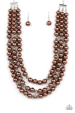 Load image into Gallery viewer, Infused with silver beads and silver rings, a bubbly collection of brown pearls are threaded along invisible wires that cascade into effervescent layers below the collar. Features an adjustable clasp closure.  Sold as one individual necklace. Includes one pair of matching earrings.
