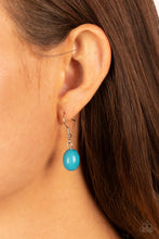 Load image into Gallery viewer, Blue bead hanging from a silver fish hook earring.
