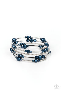 Bubbly blue pearls, cylindrical silver beads, and glassy white rhinestones are threaded along a coiled wire, resulting in a timeless infinity wrap bracelet around the wrist.  Sold as one individual bracelet.