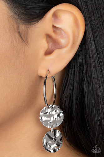 A linked pair of hammered silver discs glides along a classic silver hoop, adding an edgy twist to the timeless look. Earring attaches to a standard post fitting. Hoop measures approximately 1 1/4