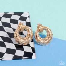Load image into Gallery viewer, Faux gold wires wrap across the front of a curvy hoop at the bottom of a decorative gold fitting, resulting in an edgy refinement. Earring attaches to a standard clip-on fitting.  Sold as one pair of clip-on earrings.
