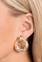 Load image into Gallery viewer, Faux gold wires wrap across the front of a curvy hoop at the bottom of a decorative gold fitting, resulting in an edgy refinement. Earring attaches to a standard clip-on fitting.  Sold as one pair of clip-on earrings.
