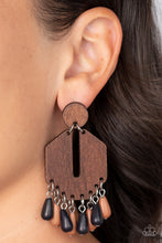 Load image into Gallery viewer, Teardrop black and brown stone beads sway from the bottom of an airy, geometric wooden frame that links to a flat wooden circle, resulting in a western inspired fringe. Earring attaches to a standard post fitting.  Sold as one pair of post earrings.
