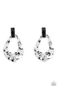 Folds of warped silver delicately gather into an edgy teardrop at the bottom of an emerald cut black rhinestone. Earring attaches to a standard post fitting.  Sold as one pair of post earrings.