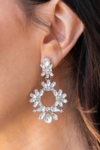 Ablaze with a mismatched assortment of brilliant white rhinestones, a stunning wreath swings from the bottom of a dainty white rhinestone fitting for a jaw-dropping dazzle. Earring attaches to a standard post fitting.  Sold as one pair of post earrings.