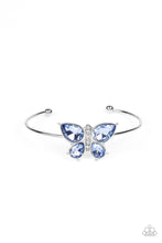 Load image into Gallery viewer, A silver butterfly with blue teardrop rhinestone wings and a white-rhinestone body delicately perches atop a shiny silver cuff.  Sold as one individual bracelet.
