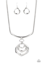 Load image into Gallery viewer, Warped silver hoops glisten from the bottom of a bowing silver bar set in the center of a rounded silver snake chain, resulting in a contemporary centerpiece below the collar. Features an adjustable clasp closure.  Sold as one individual necklace. Includes one pair of matching earrings.
