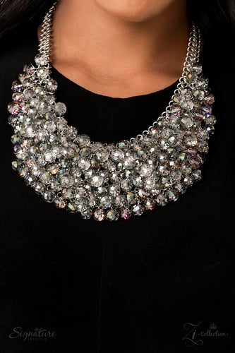Countless clear, crystal beads connect to a netted backdrop of interlocking silver links, building into a boisterous display of glassy elegance. Each faceted edge of the beads is brushed in a dreamy, reflective, colorful finish, resulting in an effervescent masterpiece that flickers and flashes at every turn. Features an adjustable clasp closure. Due to its prismatic palette, color may vary.  Sold as one individual necklace. Includes one pair of matching earrings.