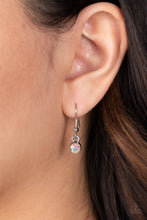 Load image into Gallery viewer, A single  iridescent rhinestone, hanging from a silver fish hook earring.
