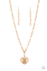 Dangling from a gold figaro chain, a charming heart pendant swings. Stamped upon the shiny surface, the phrase "Trust in the Lord" with the bible reference listed below it "Proverbs 3:5" are listed in different fonts for an optimistic and hopeful finish. Features an adjustable clasp closure.  Sold as one individual necklace. Includes one pair of matching earrings.