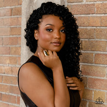 Load image into Gallery viewer, A thick band of glistening gold arcs across the finger, with two sharp points jutting out at the ends, coalescing into a bold, asymmetrical centerpiece. Features a stretchy band for a flexible fit.  Sold as one individual ring.

