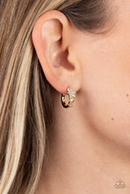 Load image into Gallery viewer, A shiny gold bar curls around the ear into a dainty hoop. Three gold stars gradually increase in size as they climb the curve of the hoop, with the biggest star emblazoned with white crystal-like rhinestones across its surface. Earring attaches to a standard post fitting. Hoop measures approximately 1/2&quot; in diameter.  Sold as one pair of hoop earrings.

