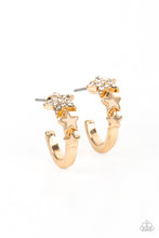 Load image into Gallery viewer, A shiny gold bar curls around the ear into a dainty hoop. Three gold stars gradually increase in size as they climb the curve of the hoop, with the biggest star emblazoned with white crystal-like rhinestones across its surface. Earring attaches to a standard post fitting. Hoop measures approximately 1/2&quot; in diameter.  Sold as one pair of hoop earrings.
