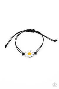 Held together and centered within soft black cording, a single daisy charm rests. Featuring a silver smiley face in its yellow center, this single flower provides a fashionably, minimalistic statement around the wrist. Features an adjustable sliding knot closure.  Sold as one individual bracelet.