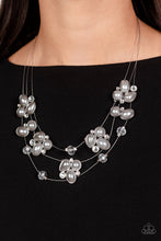 Load image into Gallery viewer, Strung along a trio of delicate silver wires, an ethereal collection of white crystal-like gems, clear faceted beads, and timeless gray pearls are pressed into teardrop, oval, and circular frames as they cluster along the collar. The mismatched clusters of sparkle and refinement seemingly float across the neckline, emitting an air of effortless elegance. Features an adjustable clasp closure.  Sold as one individual necklace. Includes one pair of matching earrings.

