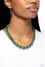 Load image into Gallery viewer, A single strand of emerald green pearls elegantly cascades below the collar, creating a glamorous graceful effect. Features an adjustable clasp closure.  Sold as one individual necklace. Includes one pair of matching earrings.
