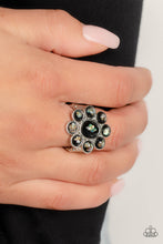 Load image into Gallery viewer, Pressed into a high-sheen silver frame, flecks of iridescent shell shimmer against a background of black, creating an ethereal flower centerpiece atop the finger. Features a stretchy band for a flexible fit. Due to its prismatic palette, color may vary.  Sold as one individual ring.

