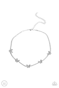 A row of dainty white rhinestones pressed into silver box-chain settings, a collection of silver butterflies coalesces around the neckline for a whimsical finish. Each butterfly features a dainty shimmer of white rhinestones on its wings, for a sparkly statement. Features an adjustable clasp closure.  Sold as one individual choker necklace. Includes one pair of matching earrings.