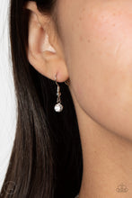 Load image into Gallery viewer, Small dainty single rhinestone hanging from a silver fish hook earring.
