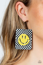 Load image into Gallery viewer, Set against a trendy, checkerboard backdrop, an oversized, sparkly, yellow smiley face stands out for a cheerfully captivating statement piece near the ear. Earring attaches to a standard fishhook fitting.  Sold as one pair of earrings.
